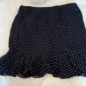 Size 12 gently worn Ralph Lauren black and white polka dot skirt with zipper.